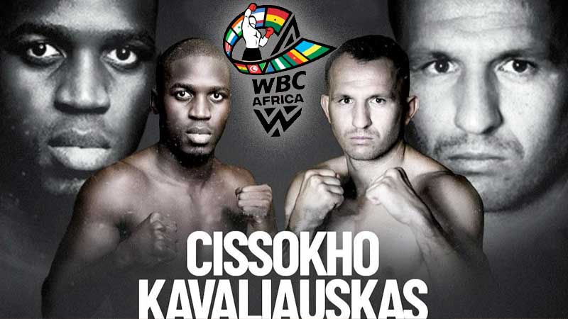 Two boxers stand shirtless in front of a promotional poster for a WBC Africa fight. Above them is the colorful WBC Africa logo. The names “Cissokho” and “Kavaliauskas” appear in large white text.